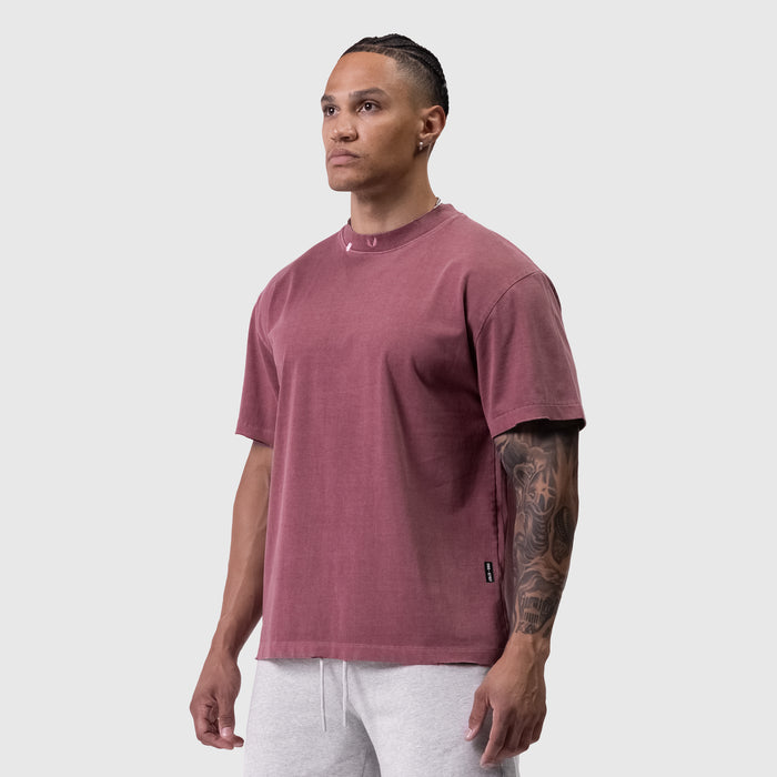 Tech Essential Relaxed Tee in faded crimson worn by male model, front view