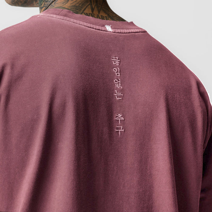 Tech Essential Relaxed Tee in Faded Crimson worn by model, back view with vertical text detail