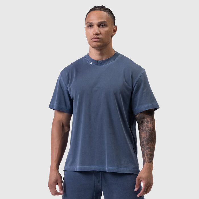 Tech Essential™ Relaxed Tee in faded navy worn by male model, front view