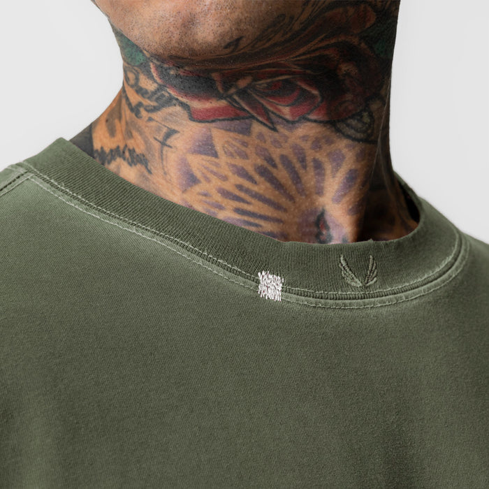Tech Essential Relaxed Tee in Faded Olive worn by model, neckline detail view