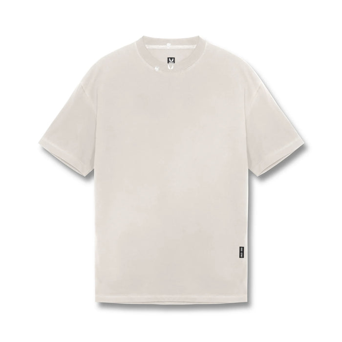 flatlay Tech Essential Relaxed Tee in faded stone, front view