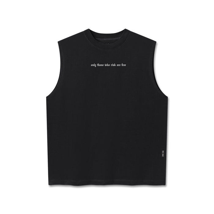 Flatlay of a black sleeveless tank top with a crew neck, featuring "only those who risk are free" text on the center chest and a small black tag on the lower right hem, displayed on a clean white background.