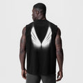 Tech Essential Relaxed Cutoff in black worn by model, back view showing reflective graphic