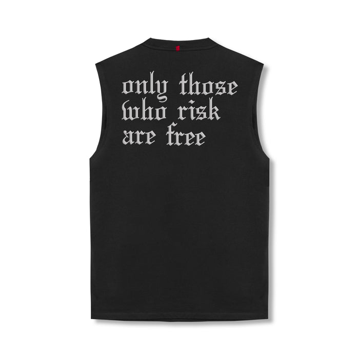 flatlay black sleeveless tank top with white gothic text reading 'only those who risk are free', back view