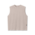 flatlay Tech Essential Relaxed Cutoff sleeveless tank in faded chai, front view