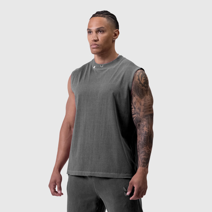 Tech Essential Relaxed Cutoff sleeveless tank in faded grey, worn by model