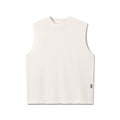 flatlay Tech Essential Relaxed Cutoff sleeveless tank in faded stone, front view