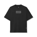 Flatlay of ASRV AeroSilver Oversized Tee in black with gray box logo, front view