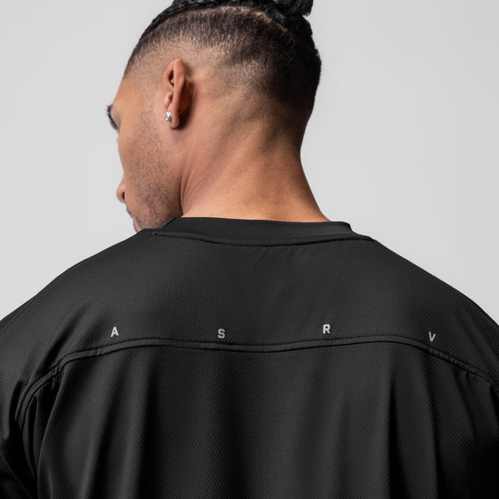 AeroSilver Oversized Tee in black worn by model, back view showing ASRV lettering