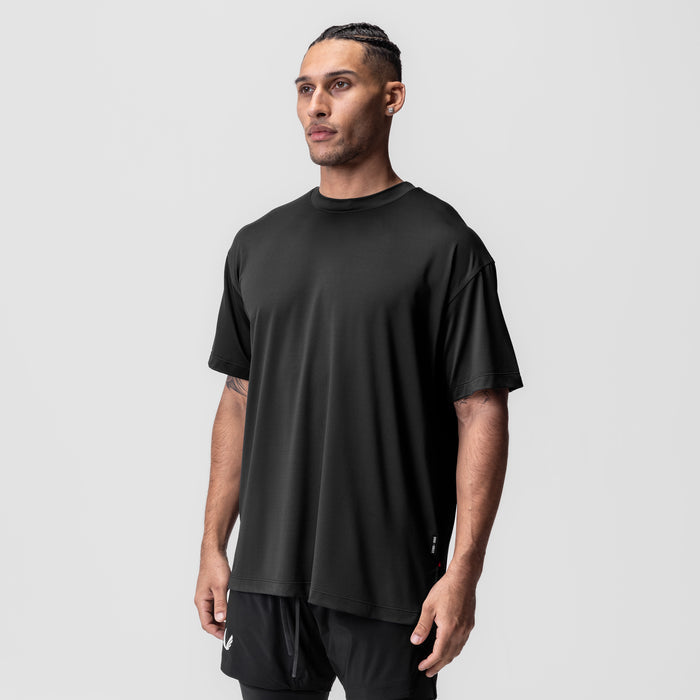 AeroSilver Oversized Tee in black, worn by model in three-quarter front view
