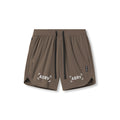 Flatlay of ASRV Tetra-Lite 7" Linerless Shorts in deep taupe with 'Bracket' logo, front view