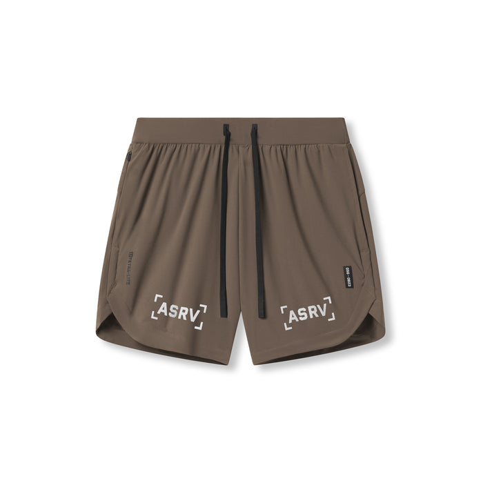 Flatlay of ASRV Tetra-Lite 7" Linerless Shorts in deep taupe with 'Bracket' logo, front view