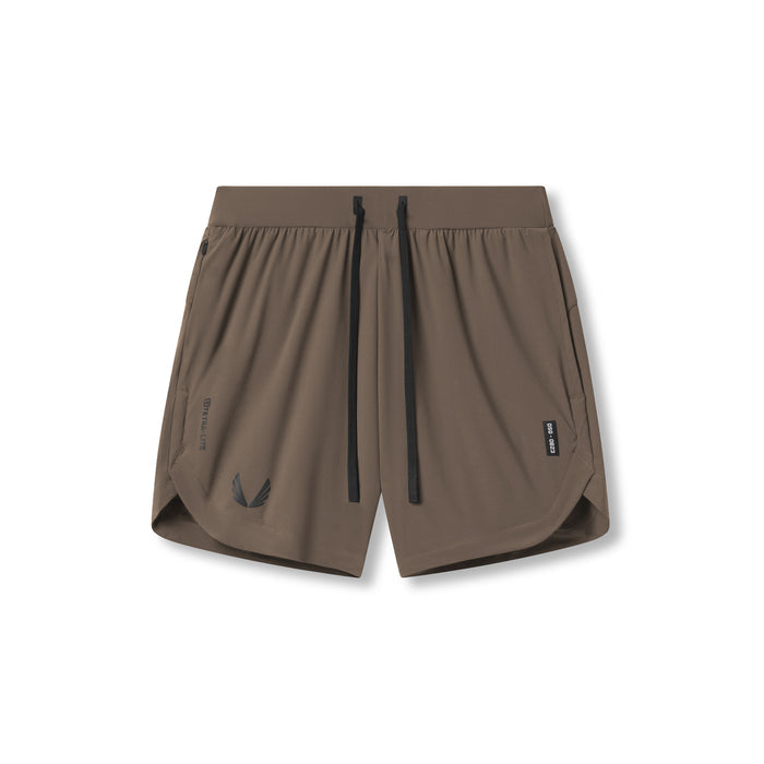 flatlay Tetra-Lite 7" Linerless Short in deep taupe with Wings logo, front view
