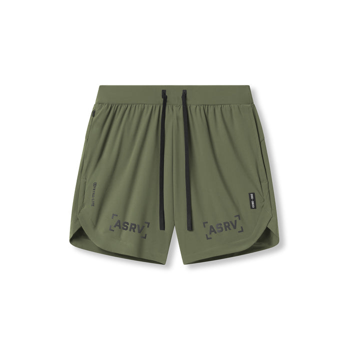 Flatlay of Tetra-Lite 7" Linerless Short in olive with bracket logo detail, front view
