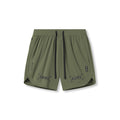 Flatlay of Tetra-Lite 7" Linerless Short in olive with bracket logo detail, front view