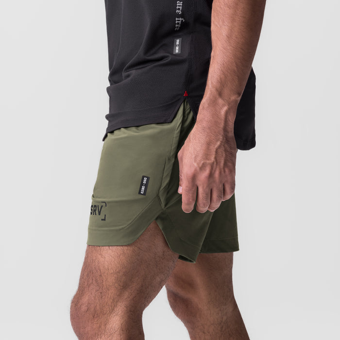 Tetra-Lite 7" Linerless Short in olive, worn by model, side view