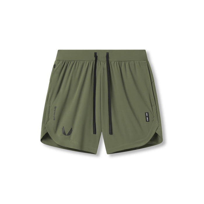 Flatlay of Tetra-Lite 7" Linerless Shorts in olive with wings logo, front view