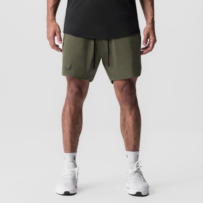 Tetra-Lite 7" Linerless Short in olive, worn by model, front view