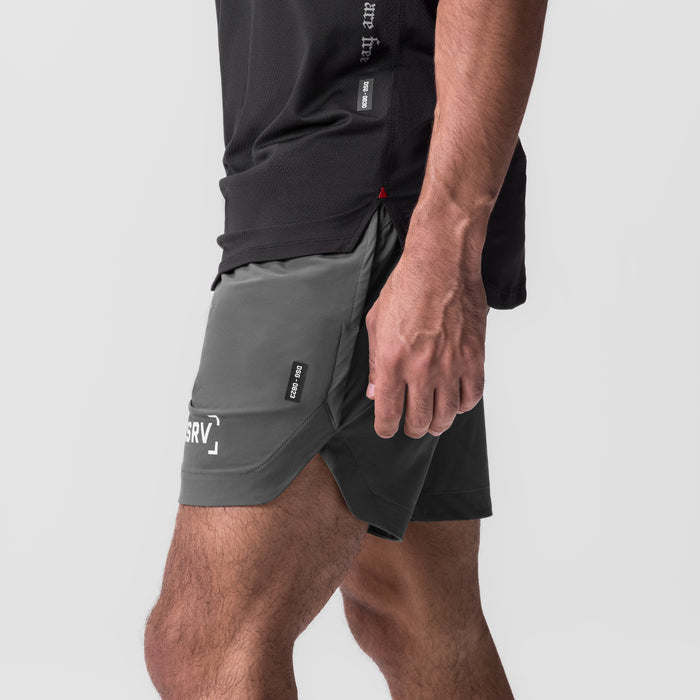Tetra-Lite 7" Linerless Short in Raven, worn by model showing side view