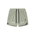 Flatlay of ASRV Tetra-Lite 7" Linerless Shorts in sage with bracket logo, front view
