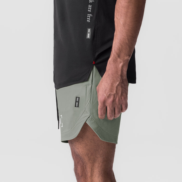 Tetra-Lite 7" Linerless Short in sage, worn by model, side view