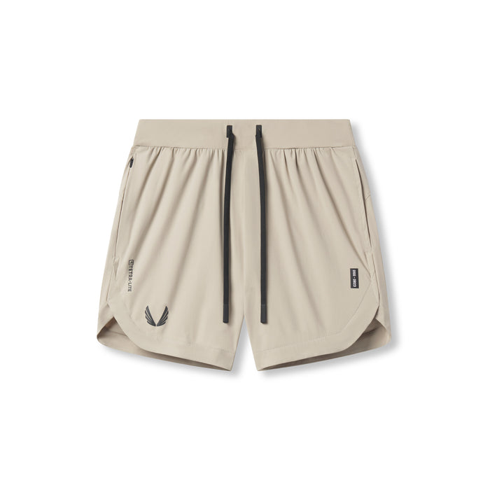 Flatlay of Tetra-Lite 7" Linerless Short in Sand Smoke with Wings logo, front view