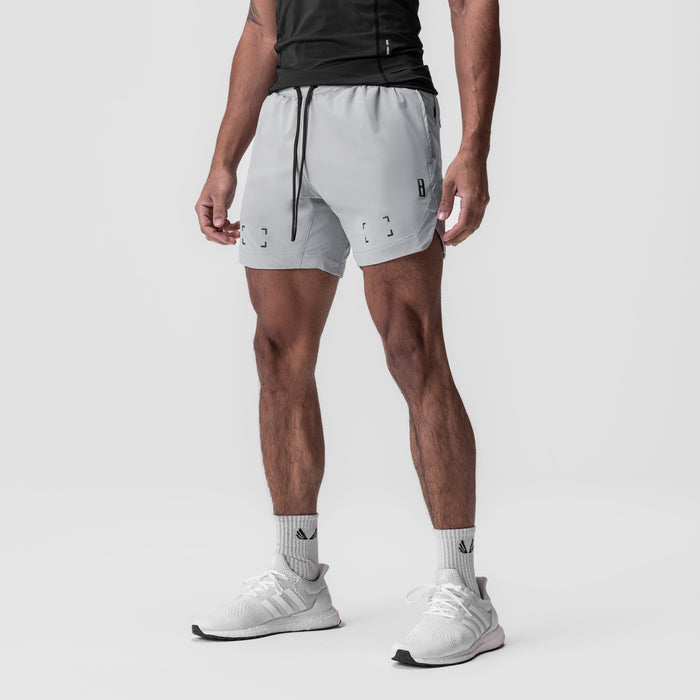 Tetra-Lite 7" Linerless Short in slate grey, worn by model standing in profile