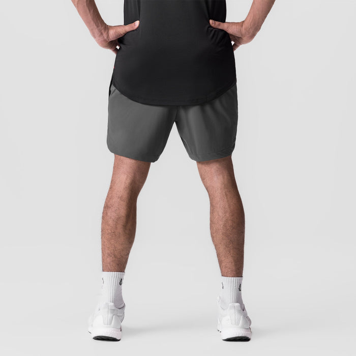 Tetra-Lite 7" Linerless Short in Space Grey, worn by model in athletic stance