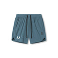 Flatlay of Tetra-Lite 7" Linerless Shorts in storm blue with white wings logo, front view