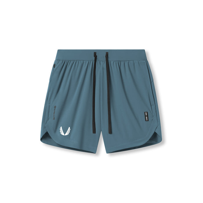 Flatlay of Tetra-Lite 7" Linerless Shorts in storm blue with white wings logo, front view