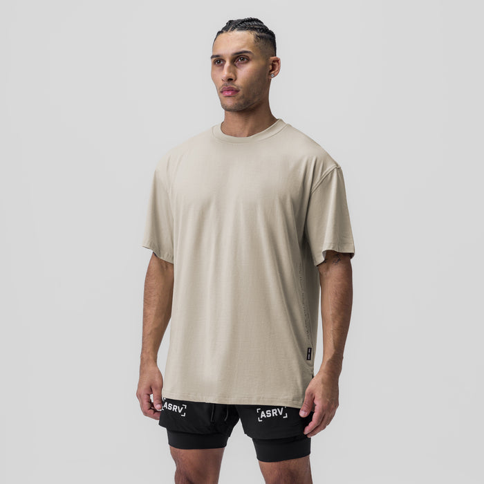 Supima® Oversized Tee in Sand Smoke worn with black shorts, front view