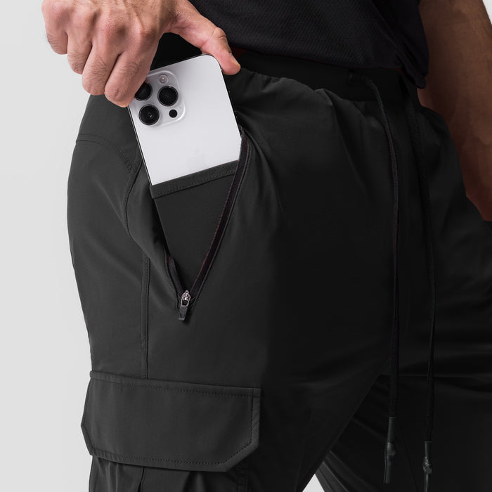 Black Tetra-Lite Cargo High Rib Jogger worn by model, showing phone pocket detail