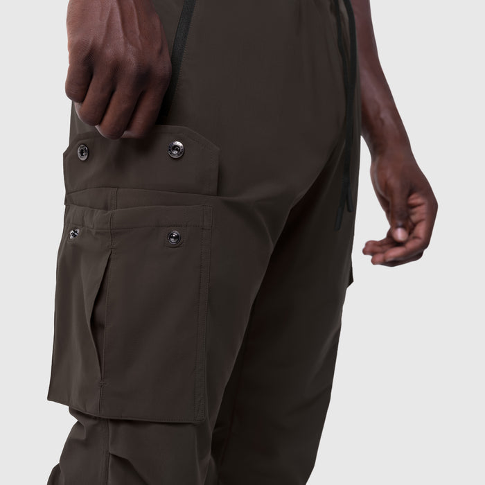 Tetra-Lite Cargo High Rib Jogger in Dark Earth, worn by model showing side cargo pockets