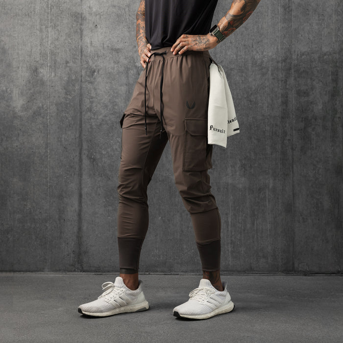 Tetra-Lite® Cargo High Rib Jogger in deep taupe, worn by model standing against gray wall