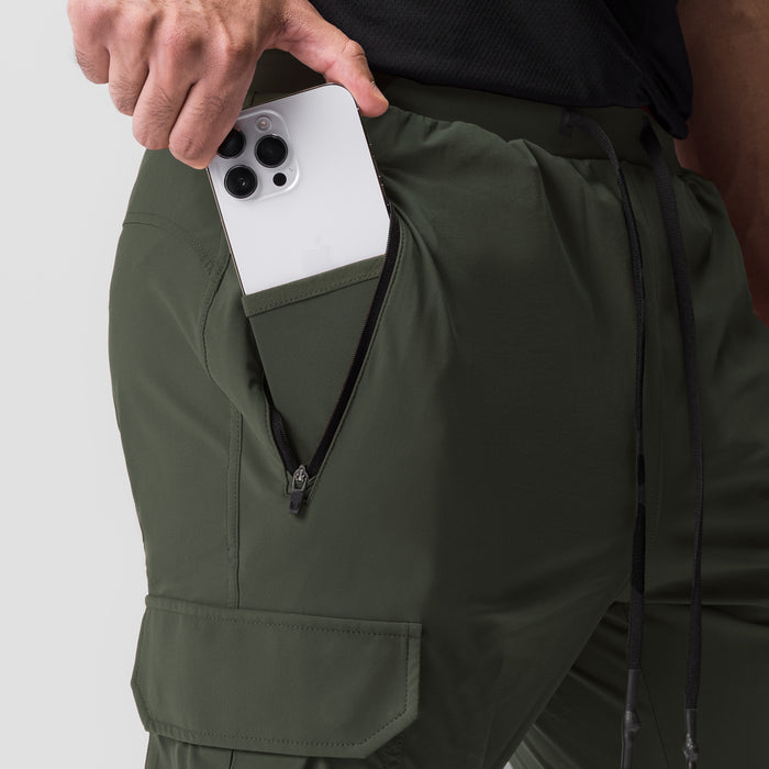 Tetra-Lite Cargo jogger in olive worn by model, showing phone pocket detail