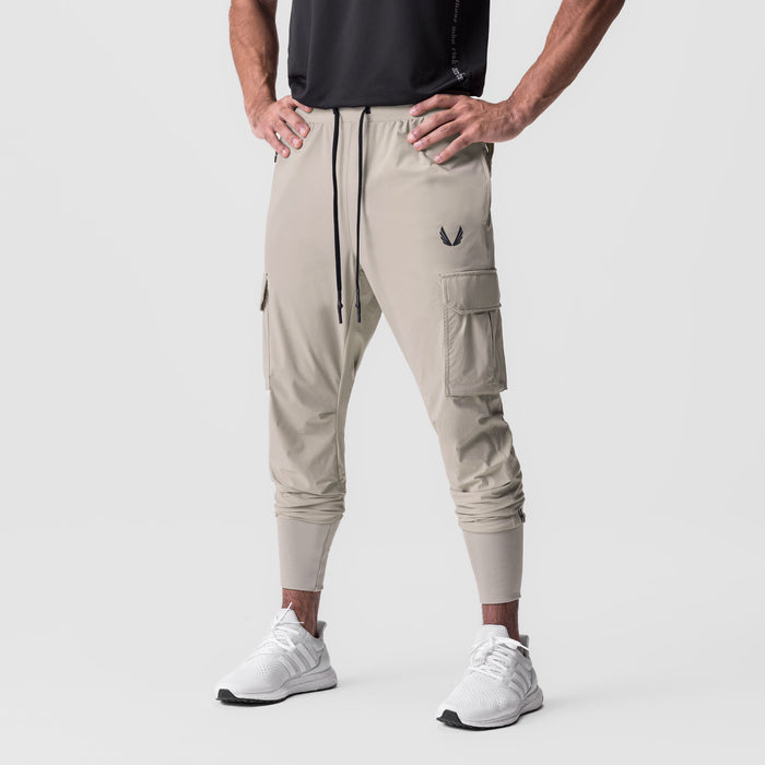 Tetra-Lite Cargo High Rib Jogger in Sand Smoke, worn by model, front view