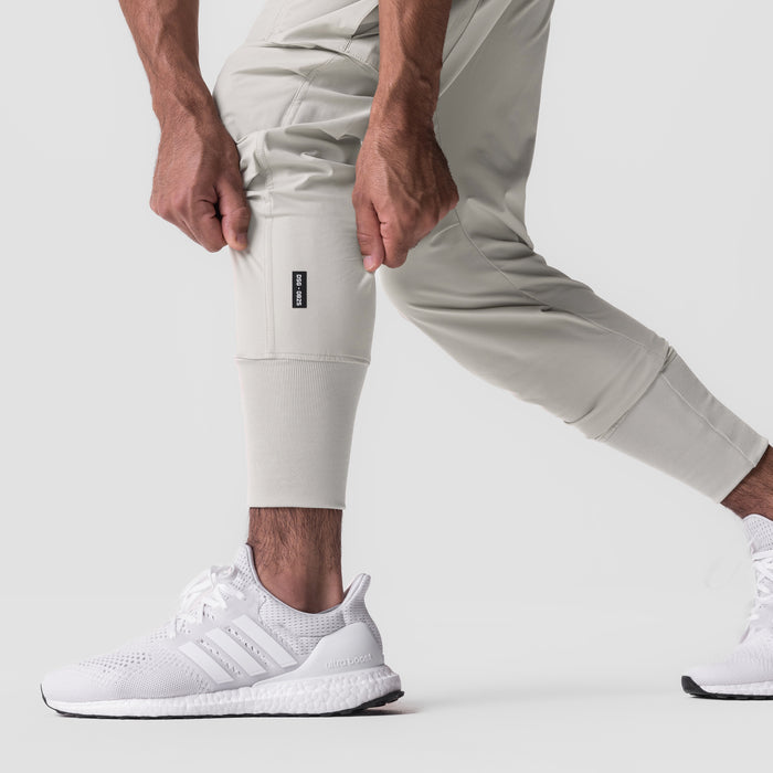 Tetra-Lite Cargo High Rib Jogger in stone, worn by model with hands at thighs