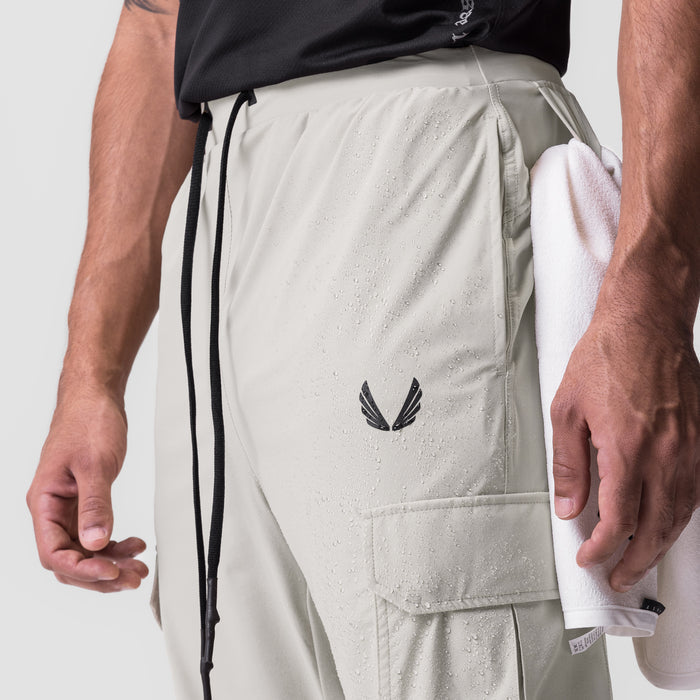 Tetra-Lite Cargo High Rib Jogger in stone, modeled from waist down showing cargo pocket detail