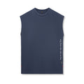Flatlay of Silver-Lite™ 2.0 Oversized Cutoff sleeveless tank in navy with OTWR text detail