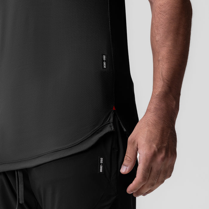 Black AeroSilver® tank top worn by model, side view showing fit and fabric detail