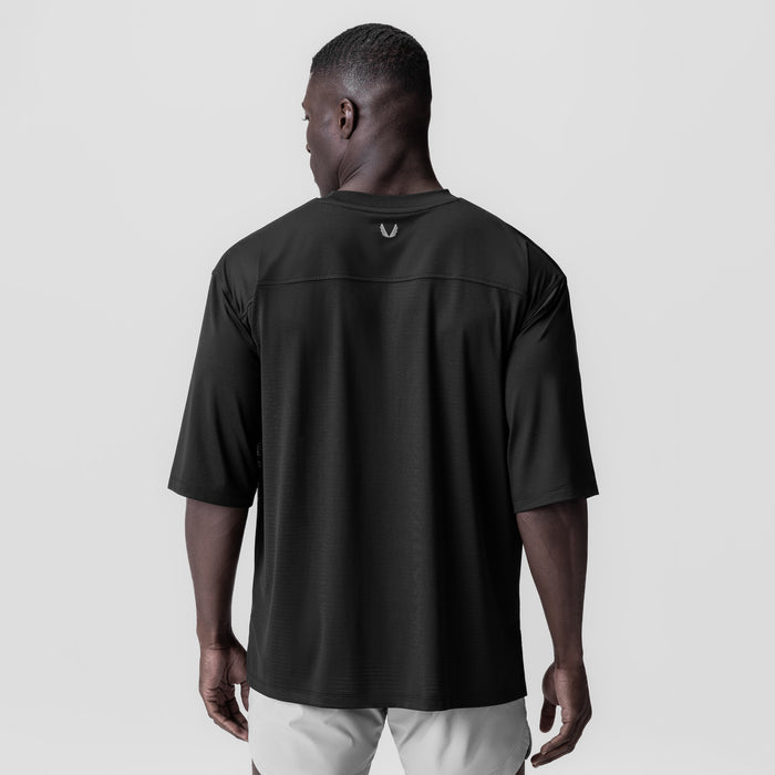 Black 3D-Lite® 2.0 Lycra® 3/4-sleeve oversized tee worn by model, back view