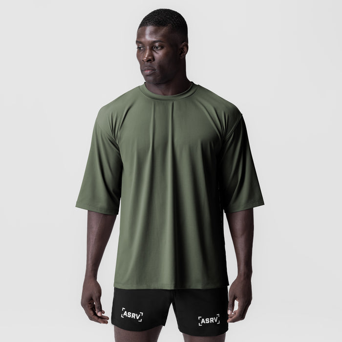 3D-Lite® 2.0 Lycra® oversized tee in olive with 3/4 sleeves, worn with black shorts