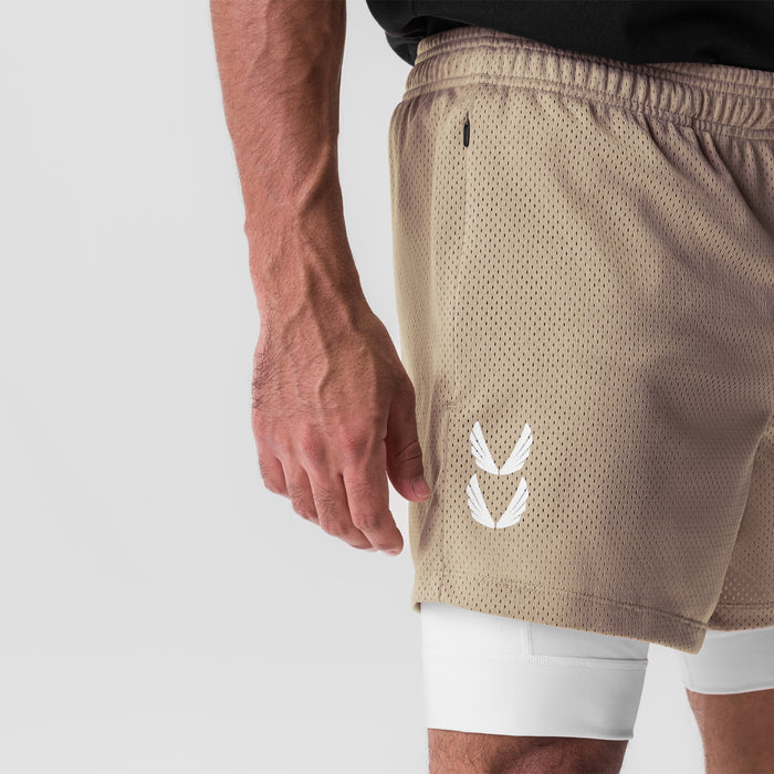 SilverPlus™ Mesh 5" Liner Short in khaki with white liner, worn by model, side view