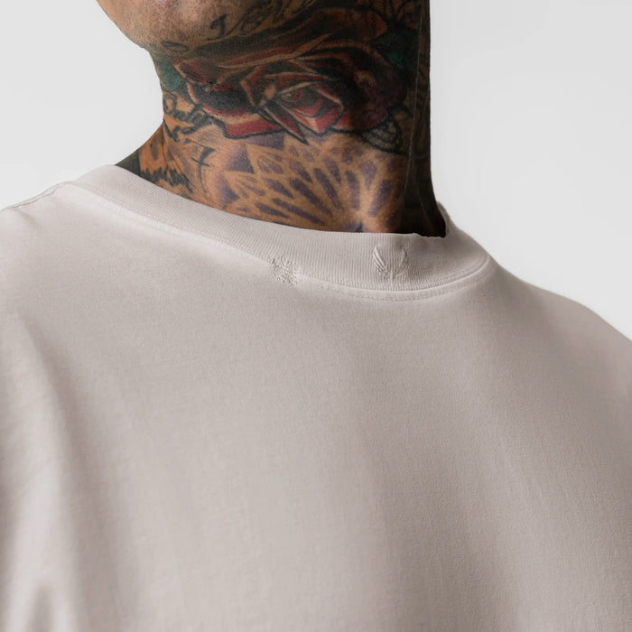 Tech Essential Relaxed Long Sleeve in Faded Chai, worn by model showing neckline detail
