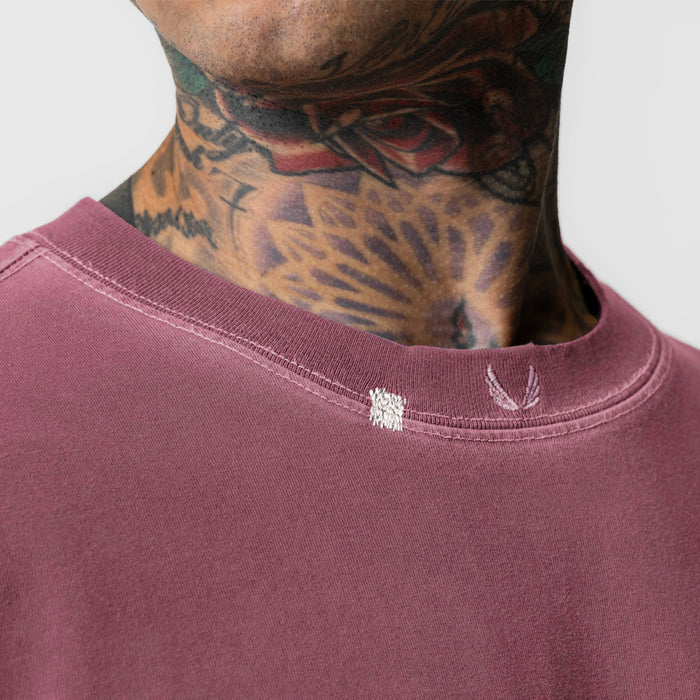 Tech Essential Relaxed Tee in Faded Crimson worn by model, showing neckline detail
