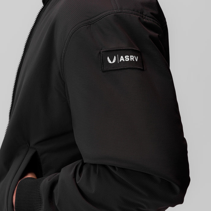 Black ripstop insulated bomber jacket worn by model, showing ASRV brand label on sleeve