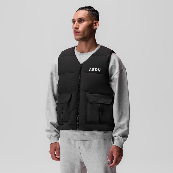 Black ripstop insulated puffer gilet worn over grey crewneck sweatshirt, front view