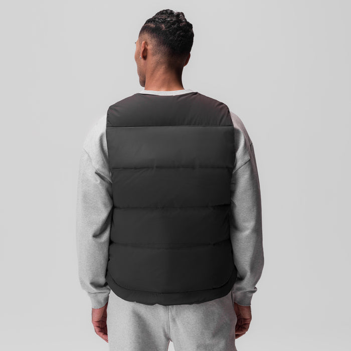 Ripstop Insulated Puffer Gilet in black, worn with grey sweatshirt, back view