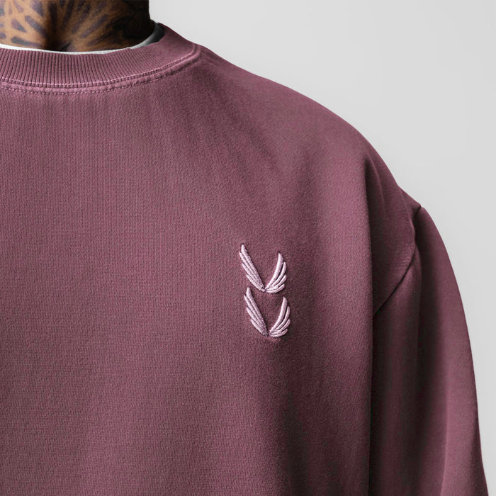 Tech Essential Distressed Crewneck in faded crimson worn by model, chest detail view