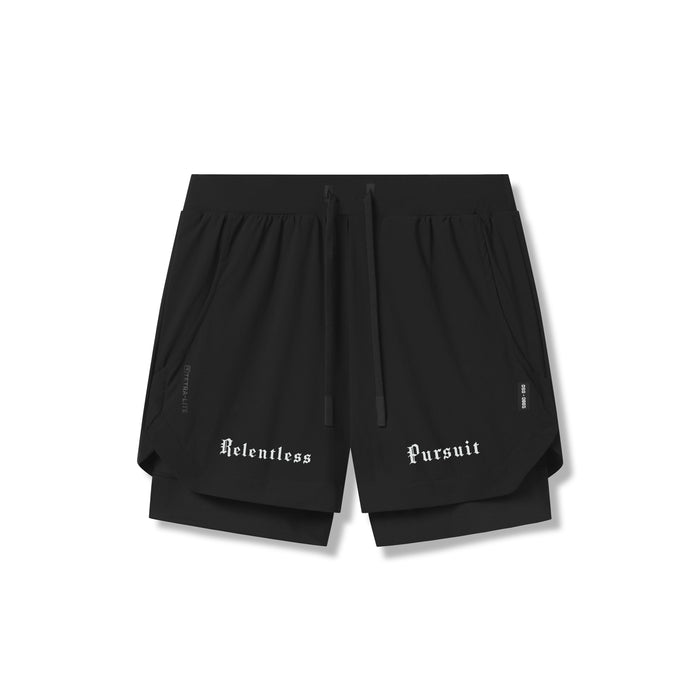 Flatlay of Tetra-Lite 5" Liner Short in black with "Relentless Pursuit" text, front view